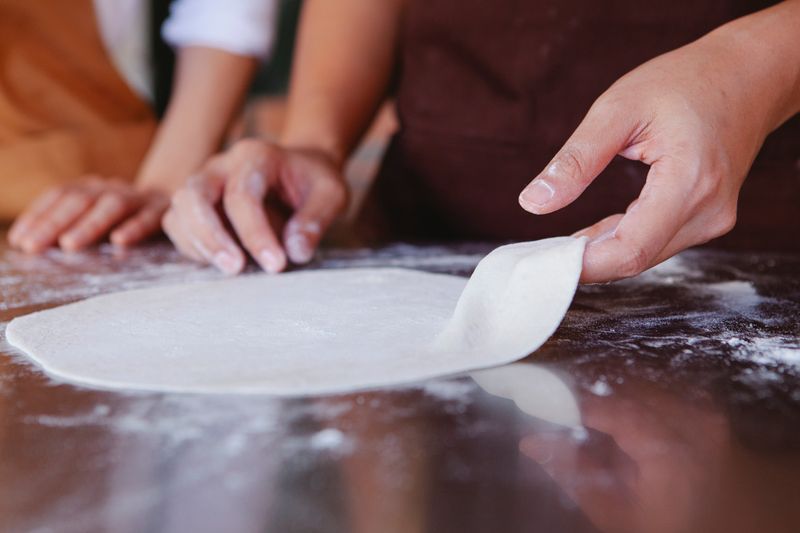 Artisan marco pizza being crafted in Marcos kitchen
