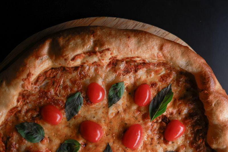 Marco's Classic Margherita pizza with fresh basil and mozzarella